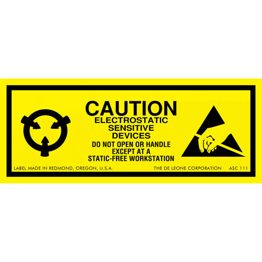 Yellow warning label for electrostatic-sensitive devices with black text and symbols.