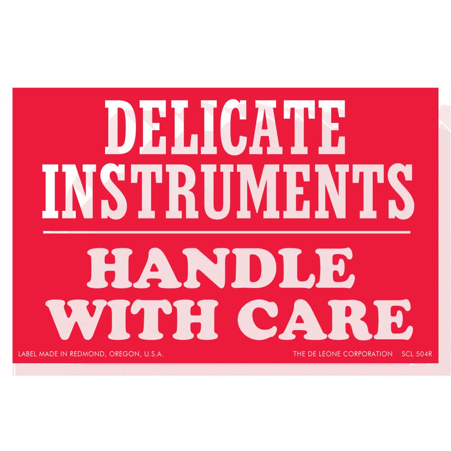 Red warning label with white text reading ’DELICATE INSTRUMENTS HANDLE WITH CARE’