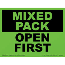 Green and black label with text reading ’MIXED PACK OPEN FIRST’