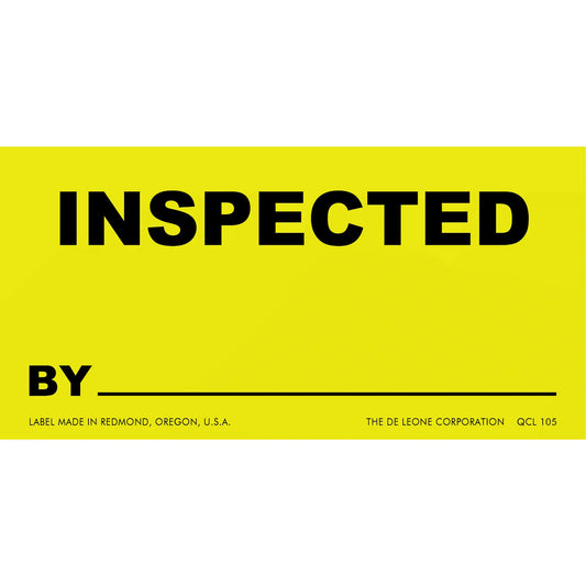 Yellow inspection label with black text reading ’INSPECTED BY’ and a blank line below.