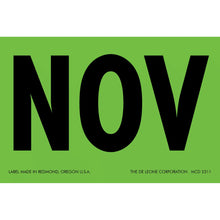 Black text ’NOV’ on a green label