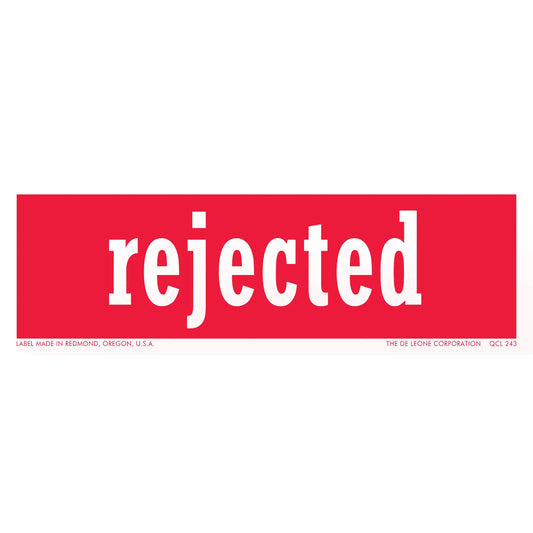 Red rectangular sticker with white text that says ’rejected’