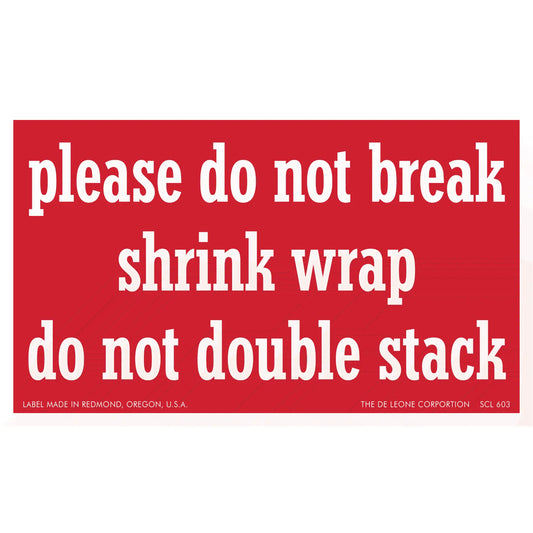 Red warning label with white text about handling shrink wrap.
