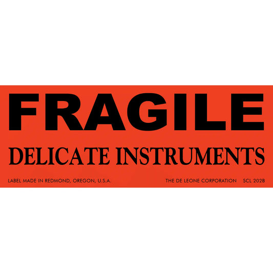 Red warning label with black text reading ’FRAGILE DELICATE INSTRUMENTS’