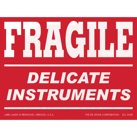 Red warning label with white text reading ’FRAGILE DELICATE INSTRUMENTS’