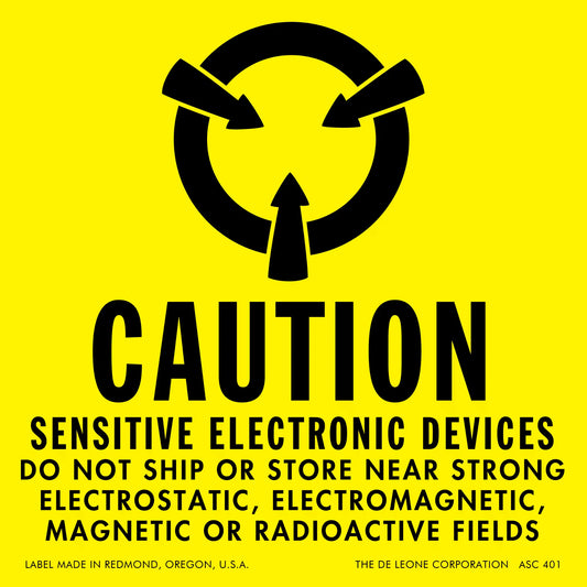 Yellow warning label for sensitive electronic devices with black text and a circular arrow symbol.