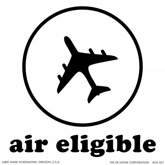 Black airplane silhouette inside a circle with text ’air eligible’ below.