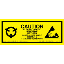 Yellow warning label for electrostatic-sensitive devices with black text and symbols.