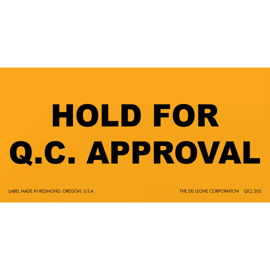 Orange warning label with black text reading ’HOLD FOR Q.C. APPROVAL’