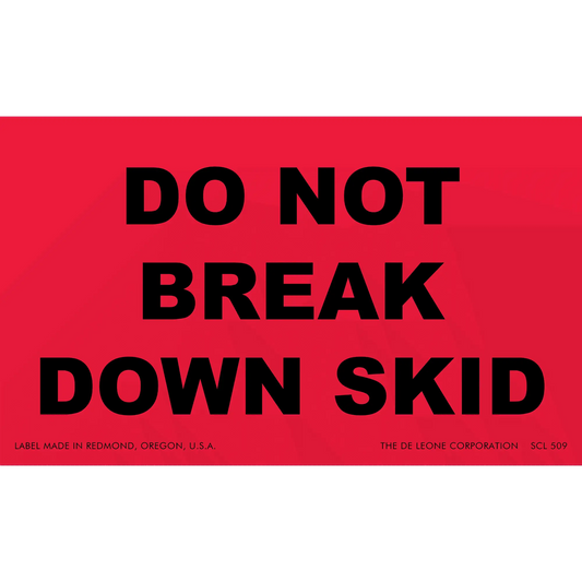 Red warning label with black text reading ’DO NOT BREAK DOWN SKID’