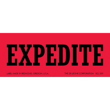 Red label with black text reading ’EXPEDITE’