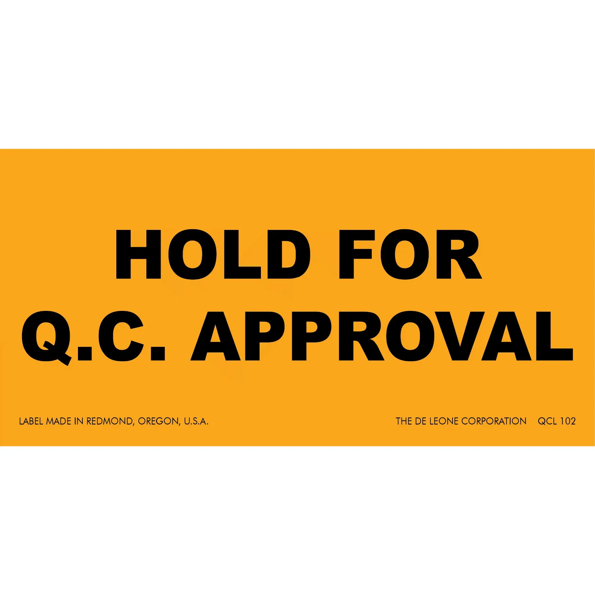 Orange warning label with black text reading ’HOLD FOR Q.C. APPROVAL’