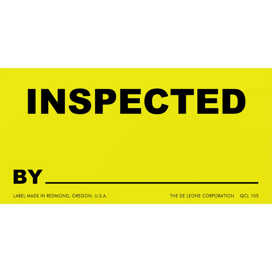 Yellow inspection label with black text reading ’INSPECTED BY’ and a blank line below.