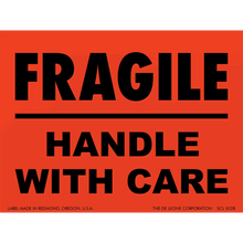 Red warning label with black text reading ’FRAGILE - HANDLE WITH CARE’