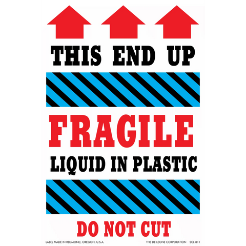 Warning label for fragile liquid contents with red arrows indicating orientation.