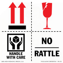 Warning label with four symbols indicating shipping instructions including upward arrows, fragile glass, handle with care, and no rattle.