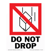 Warning sign with a crossed-out box falling symbol and ’DO NOT DROP’ text.