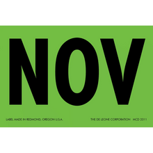 Black text ’NOV’ on a green label