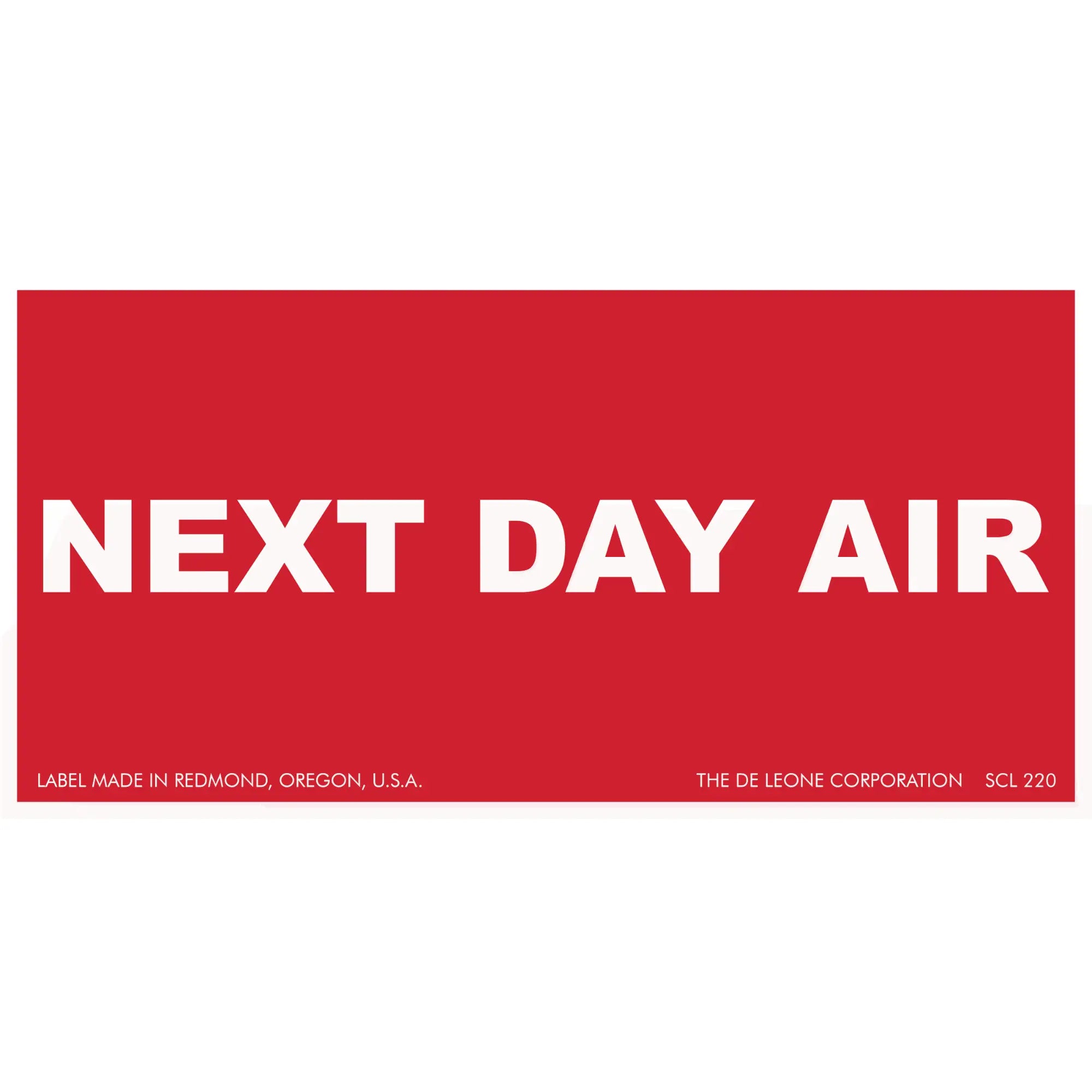 Red shipping label with white text reading ’NEXT DAY AIR’