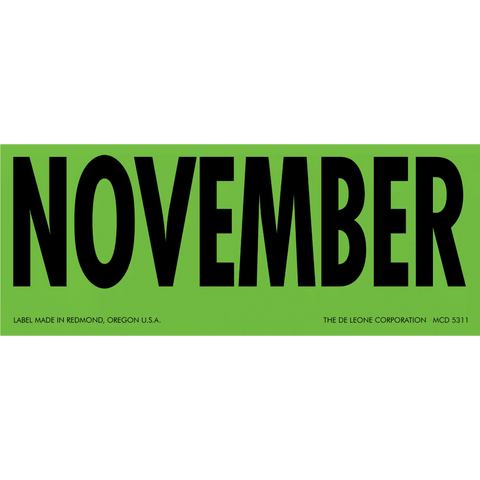 Green label with ’NOVEMBER’ printed in black text.