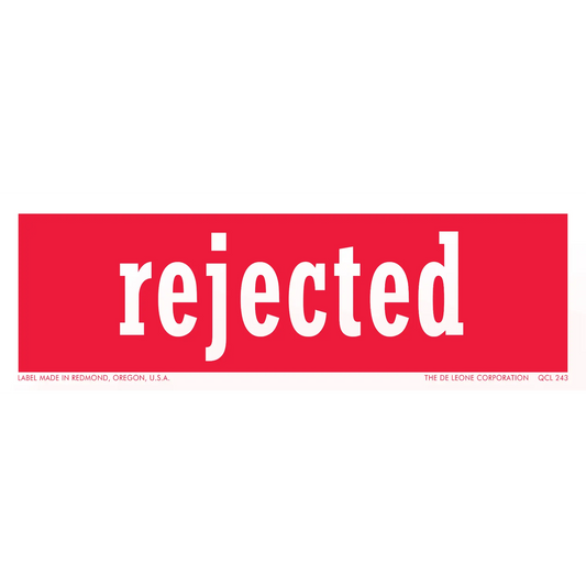 Red rectangular sticker with white text that says ’rejected’