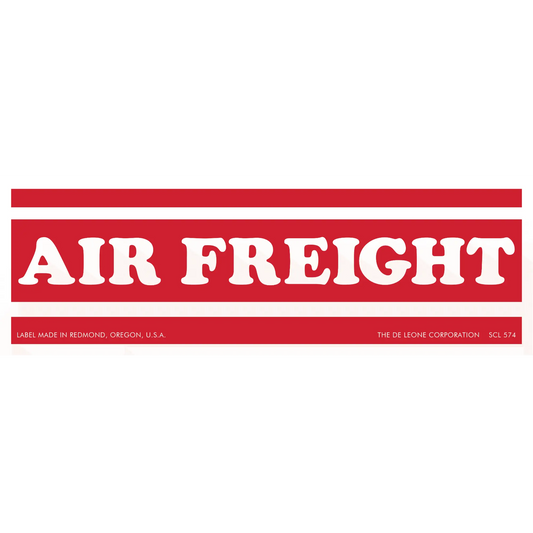 Red and white ’AIR FREIGHT’ label with horizontal stripes.