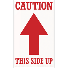 Red and white caution sign with an upward-pointing arrow and text reading ’THIS SIDE UP’