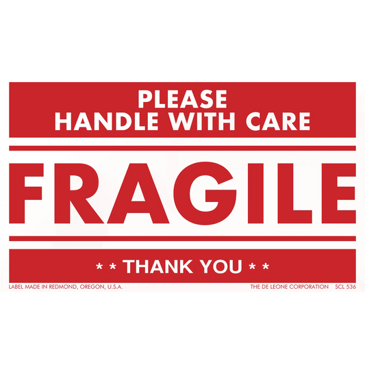 Red and white ’FRAGILE - PLEASE HANDLE WITH CARE’ shipping label.