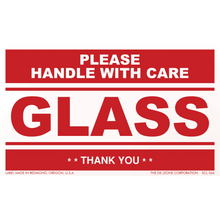 Red and white warning label for glass that reads ’PLEASE HANDLE WITH CARE’ and ’THANK YOU’