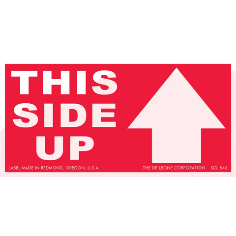 Red shipping label with white text reading ’THIS SIDE UP’ and an upward-pointing arrow.