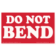 Red warning label with white text that reads ’DO NOT BEND’