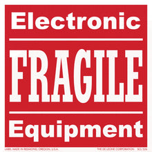 Red warning label with white text reading ’Electronic FRAGILE Equipment’