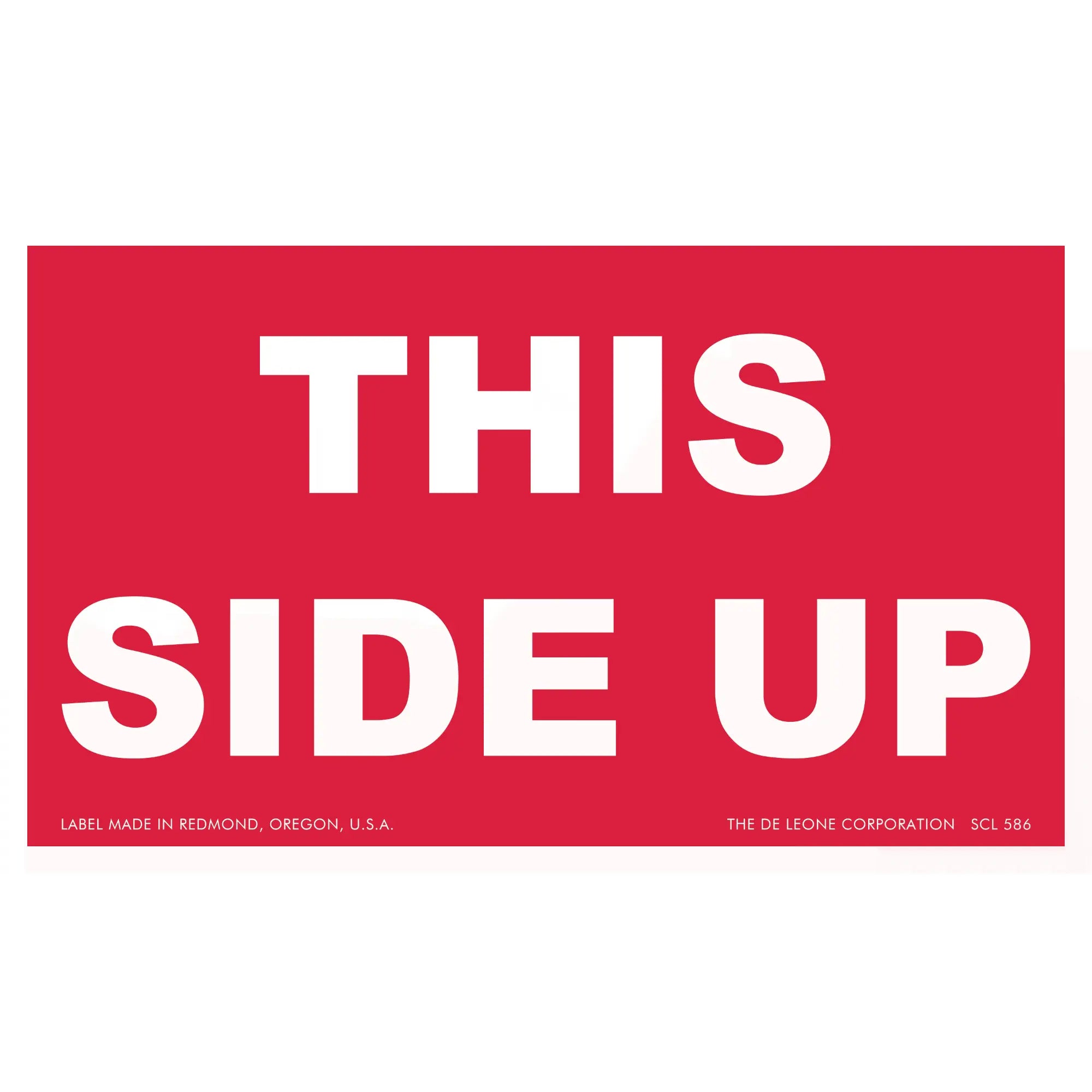 Red shipping label with white text reading ’THIS SIDE UP’