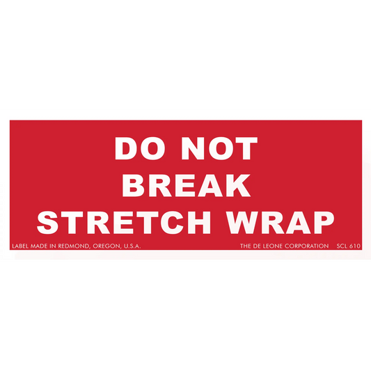 Red warning label with white text reading ’DO NOT BREAK STRETCH WRAP’