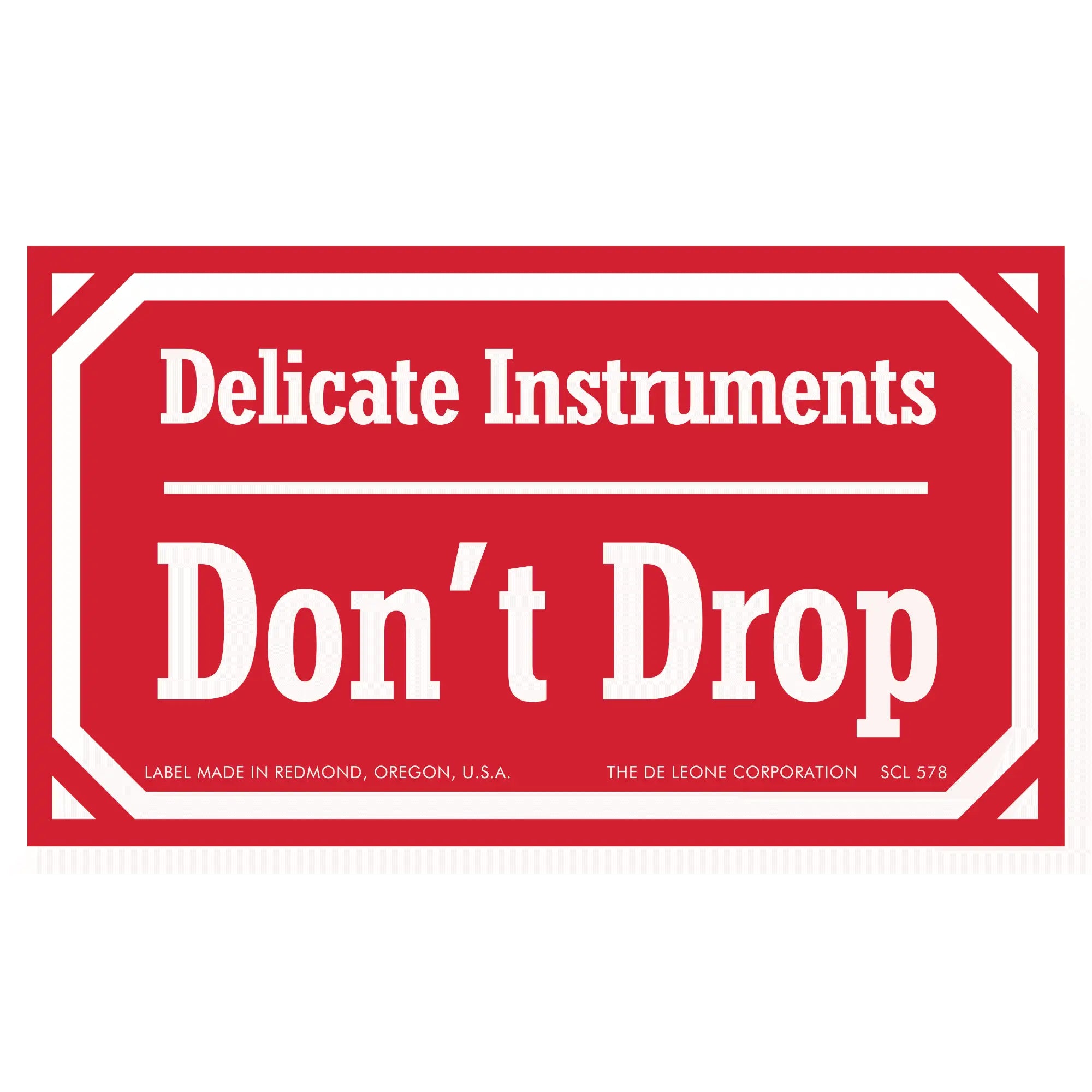 Red warning label stating ’Delicate Instruments Don’t Drop’