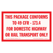 Red and white warning label stating package conformity to regulation 49 CFR-173.4 for domestic highway or rail transport.