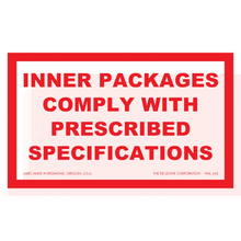 Red and white warning label stating ’INNER PACKAGES COMPLY WITH PRESCRIBED SPECIFICATIONS’