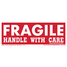 Red and white ’FRAGILE - HANDLE WITH CARE’ warning label.