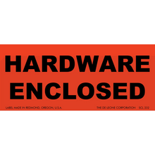 Red warning label with black text reading ’HARDWARE ENCLOSED’