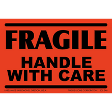 Red warning label with black text reading ’FRAGILE HANDLE WITH CARE’