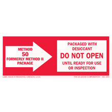 Red and white warning label about packaged desiccant and inspection requirements.