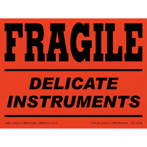 Red warning label with black text reading ’FRAGILE DELICATE INSTRUMENTS’