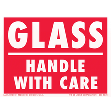 Red and white warning label for glass handling.