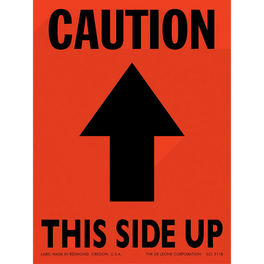 Orange caution sign with black arrow pointing upward and text reading ’THIS SIDE UP’