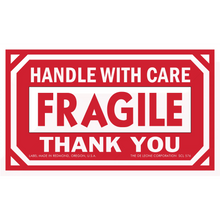 Red and white ’Handle with Care - Fragile’ shipping label.