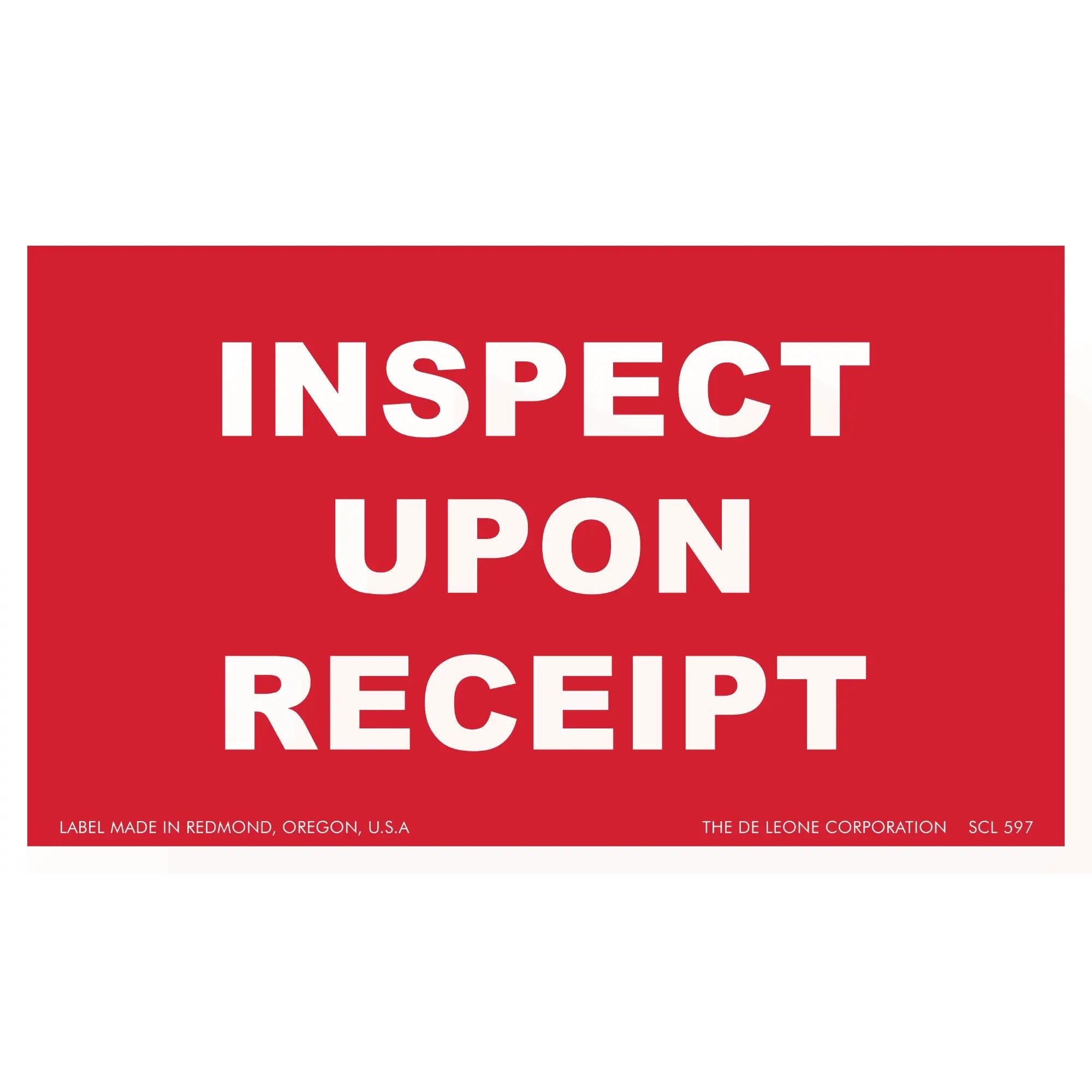 Red label with white text reading ’INSPECT UPON RECEIPT’
