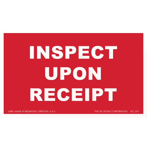 Red label with white text reading ’INSPECT UPON RECEIPT’