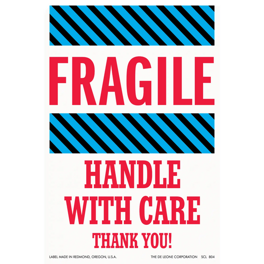 Warning label with ’FRAGILE - HANDLE WITH CARE’ text and diagonal striped borders.