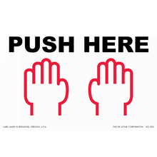 A ’PUSH HERE’ sign with two red hand icons below the text.