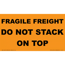 Orange warning label with black text reading ’FRAGILE FREIGHT DO NOT STACK ON TOP’